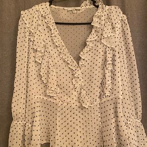 Women’s white ruffled blouse.